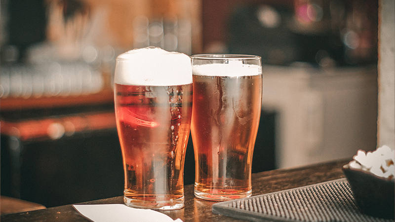 two amber ales in glasses